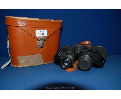 A pair of Boots compact de luxe 10x50 Binoculars in tan leather case, case a/f