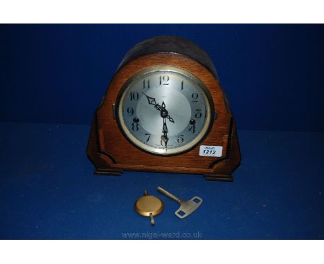 An Enfield Westminster chiming Mantle Clock with key and pendulum. 