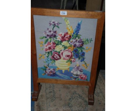 An Oak framed floral tapestry Firescreen.