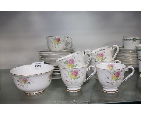 A part Staffordshire tea set in floral pattern and comprising of six cups, six saucers, six tea plates, a bread and butter pl