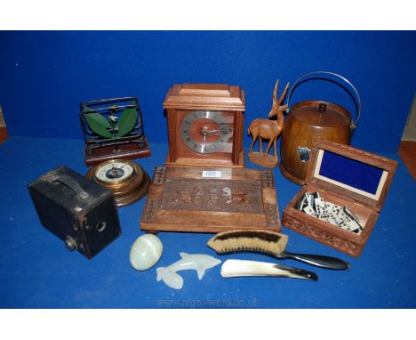 A Treen biscuit Barrel with liner and lid, small wooden cased round barometer, carved box of dominoes, clock, carved stand, o