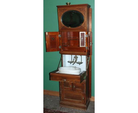 An early 1900's Ship's Dentist's full height Cabinet having a funnel-filled cistern to the top behind an angle-adjustable bev