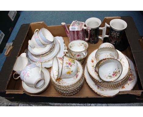 Two part Teasets, one by Foley in pale blue with pink and blue flowers and comprising four cups, five saucers, two tea plates