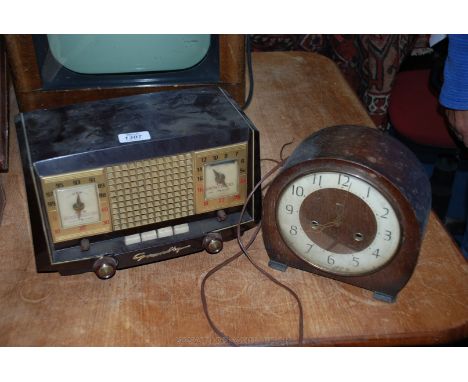 A mantle Clock together with an old Grundig Radio 