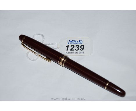 A Montblanc Meisterstruck ballpoint Pen in maroon and gold