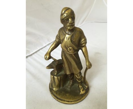 A Rover 'blacksmith' polished brass car accessory mascot.