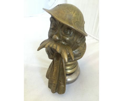 A reproduction Bruce Bairnsfather car mascot, radiator cap mounted. 