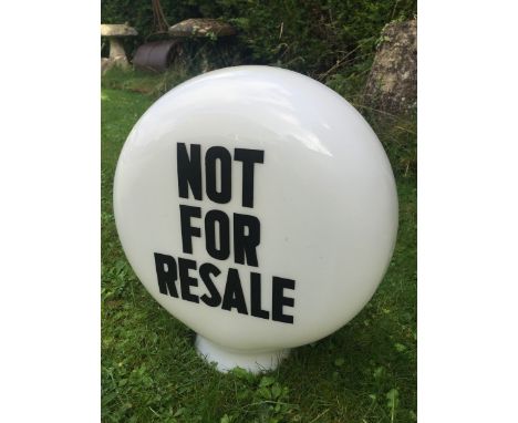 A 'Not for resale' glass petrol pump globe.