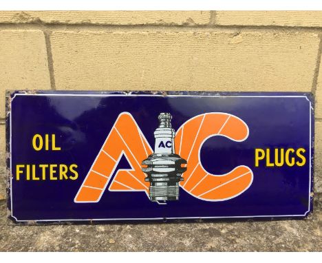 An AC Oil Filters and Plugs rectangular enamel sign, in very good condition, 21 x 9". 