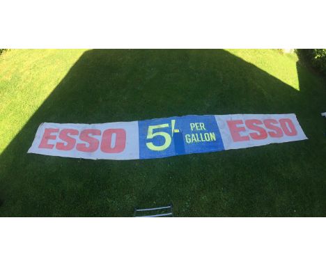 A large Esso rectangular banner - 5' per gallon, 19' 1 x 31 1/2".