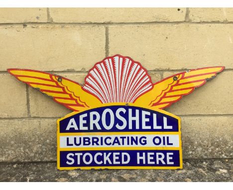 A good Aeroshell Lubricating Oil Stocked Here die-cut double sided enamel sign with excellent gloss and some minor restoratio
