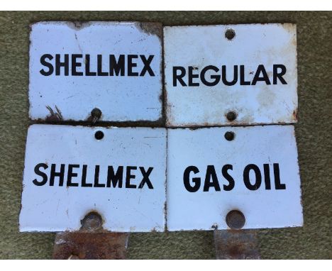 Four small enamel petrol pump tags for gas, oil, regular, and two Shellmex. 