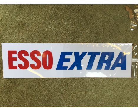 A pair of original new old stock Esso Extra plastic petrol pump panel insert signs.