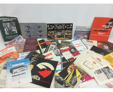 A collection of assorted sales brochures relating mostly to car accessories etc.