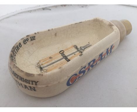 An unusual Osram Bulbs ceramic bulb-shaped desk tidy. 