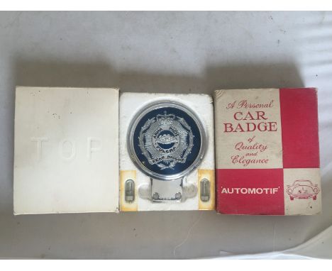 A good quality personal car badge by Beaulah, in original box and appears never fitted to a car, the central design depicting