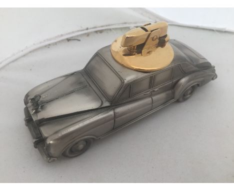 A desktop lighter in the form of a Rolls-Royce.
