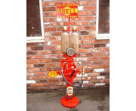 A Hammond two gallon free standing petrol pump, painted in Shell livery with reproduction brand plates/price flag attached an