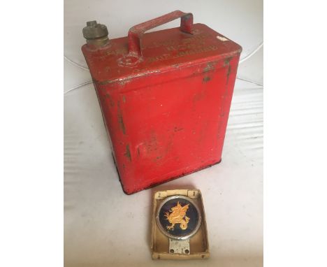 A car badge by Beaulah depicting the Welsh dragon and a two gallon petrol can.