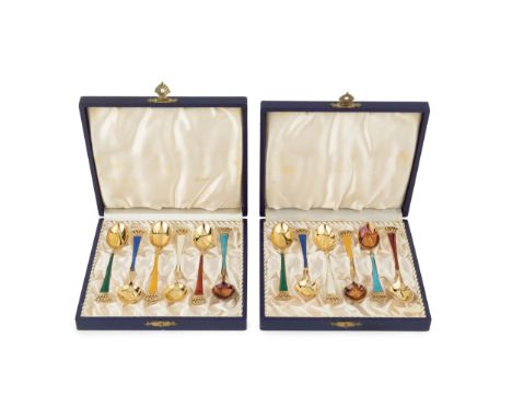 Two sets of six Danish silver-gilt and enamel coffee spoons, with vari-coloured enamel handles and pierced terminals by Egon 