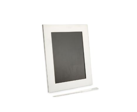 A silver rectangular photograph frame by Tiffany &amp; Co, of plain design with easel back, 23cm high, with felt bag and boxe