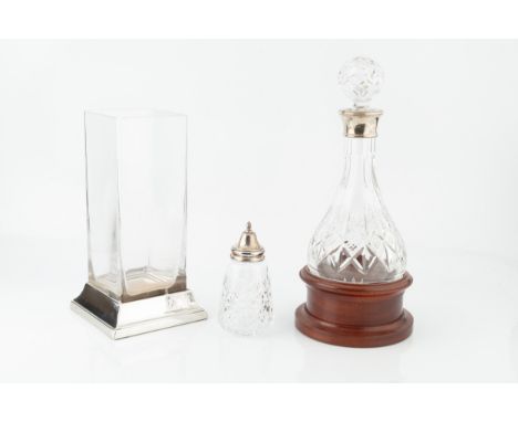 A silver mounted cut glass decanter and stopper, with rounded base and turned wooden stand, by Laurence R. Watson &amp; Co, B