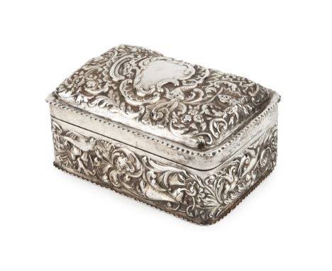 A late Victorian silver cigarette box, with domed hinged top, repoussé decorated with birds, flowers and c scrolls by William