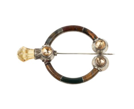 A Victorian Scottish hardstone set cloak brooch or pin, the swing pin and terminals set with faceted yellow stones, the brooc