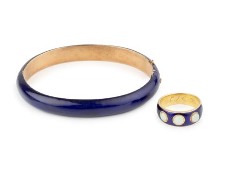 A mid Victorian gold, opal and enamel memorial ring, the plain band with rectangular blue enamel plaque, having fleur-de-lys 