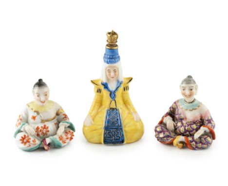 A late 19th century Continental porcelain novelty scent bottle, modelled as a seated Chinaman, his head forming the stopper, 