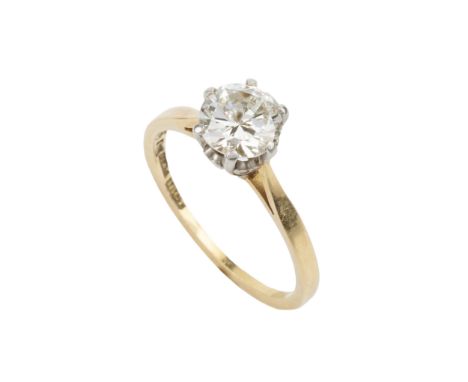 A diamond solitaire ring, the brilliant cut stone of approx 0.7ct, claw set in platinum to an 18ct yellow gold shankRing size