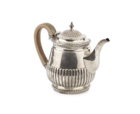 A mid Victorian silver bachelor's teapot, with gadrooned borders and part lobed decoration, having fruitwood handle by Freder