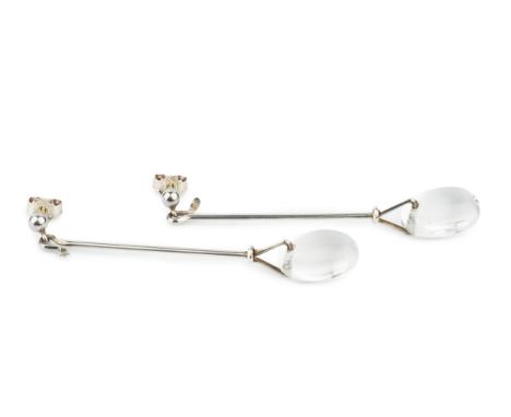 A pair of 'Dew Drop' earrings by Georg Jensen, each featuring an oval rock crystal drop suspended from a post by a hand forme