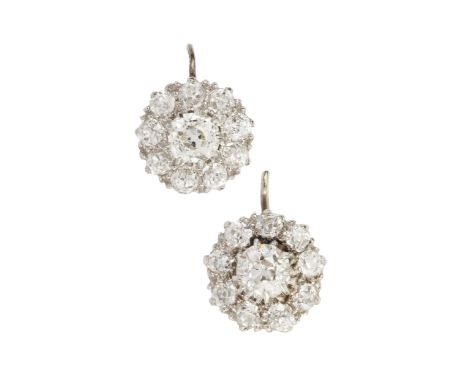 A pair of diamond cluster earrings, the central old cut stones each of approx 0.4ct within a border of 9 smaller stones, claw