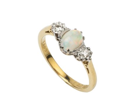 An opal and diamond three stone ring, the central oval cabochon opal flanked by a pair of small brilliant cut diamonds, claw 