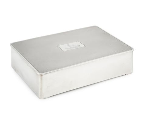 A George VI silver regimental cigarette box, the engine turned hinged cover with rounded corners and engraved with the crest 