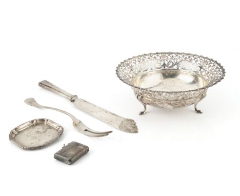 A George V silver circular dish, with scrolling foliate and trellis pierced border, on three scroll feet by James Dixon &amp;