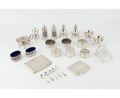 A collection of silver, comprising two cigarette cases with engine turned decoration, a five bar toast rack, a pepper grinder