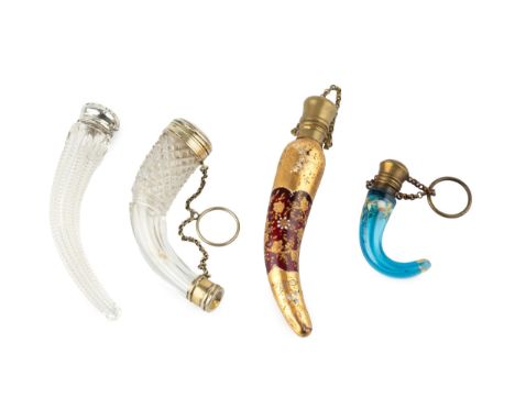 A 19th century Continental cut glass novelty scent bottle, in the form of a curved horn, with unmarked hinged cover and mount