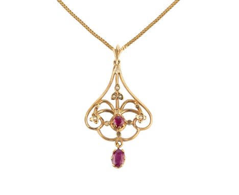 A 9ct gold, ruby and seed pearl pendant, of shaped openwork design, set with an oval cut ruby and seed pearls, and suspending