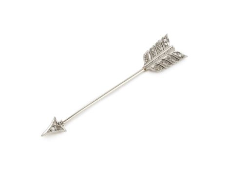 A diamond set jabot pin, in the form of an arrow, the tip and flight set with rose cut stones, 5.8cm long