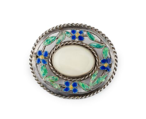 A silver and enamel Arts &amp; Crafts style oval brooch, centred with a pale cabochon opal within a pierced and enamelled bor