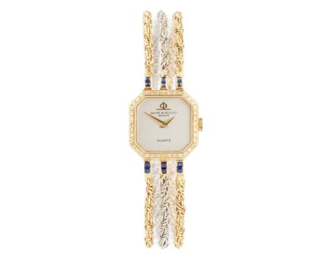 An 18ct gold and diamond lady's wristwatch by Baume &amp; Mercier, having chamfered square silvered dial with diamond set bez