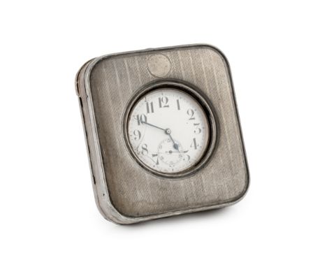 An Edwardian silver mounted watch holder, with engine turned decoration, the watch with white enamel dial, with Arabic numera