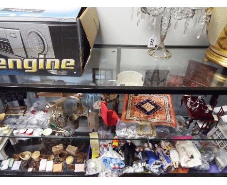 A large collection of good quality wooden dolls house furniture, miniature ceramic kitchen ware and ornamental ware, miniatur