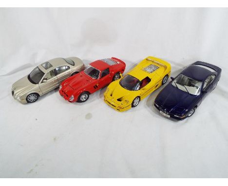 Four die-cast model motor vehicles, Ferrari GTO 1962 by Burago, Jaguar S-type by Maisto, BMW 8501 by Maisto and Ferrar4i F50 