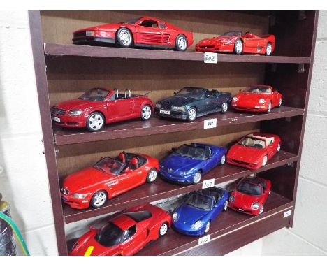 Eleven die-cast model motor vehicles, predominantly Ferraris by Burago, Mattel Hotwheels and similar, scale 1:18, excellent, 