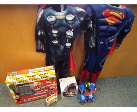 A collection of toys to include a Superman fancy dress outfit aged 5-6 years, a Marvel Avengers Superhero fancy dress age 5-6