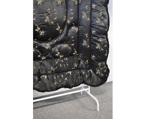 A circa 1930s Chinese Eiderdown blanket, in black silk with delicate embroidered birds and reeds throughout, backed onto blac