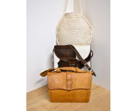 Three vintage handbags. A structured cross body bag in brown and cream cow hide, made in Ecuador, having blanket stitch seam 